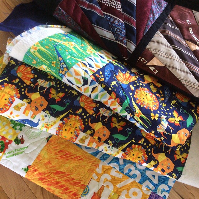 Quilts fresh from the quilter (thanks gayle) guess I have binding to do!! #hungrycaterpillar #babywilliams #origamioasis #iamadesigner happy Wednesday!